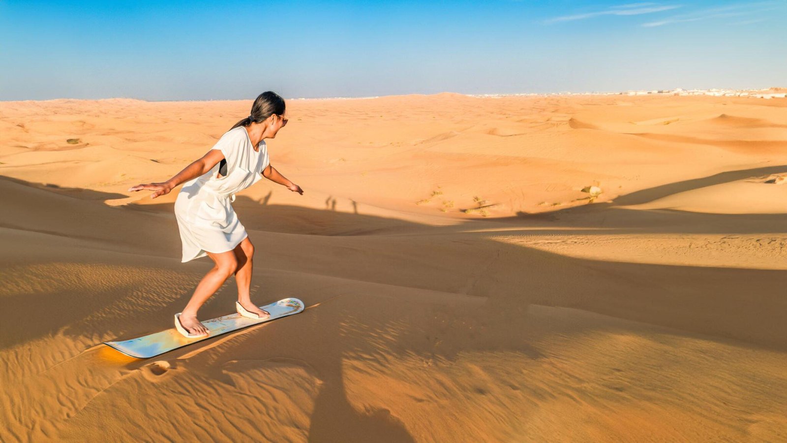 Sand boarding in dubai desert safari